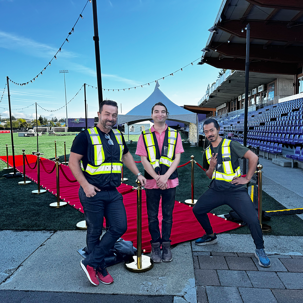 Sasa with his coworkers installing decoration lights